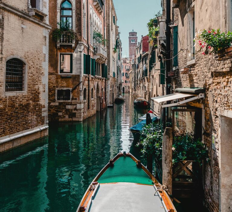 Captivating view of a traditional Venetian canal surrounded by historic buildings, perfect for travel enthusiasts.